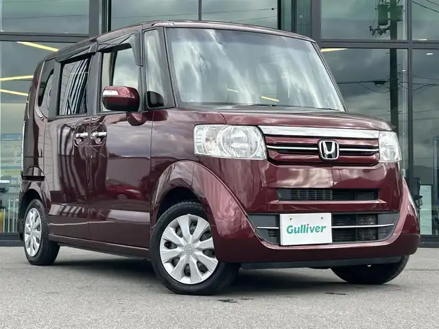 ホンダ Ｎ ＢＯＸ G Lパッケージ 愛媛県 2015(平27)年 6.3万km プレミアムディープロッソパール 純正ナビ（Bluetooth/SD/フルセグテレビ）/GPSレーザー探知機/片側電動スライドドア/バックカメラ/横滑り防止装置/チップアップシート/ベンチシート/Wエアバック/レザー調シートカバー/社外フロアマット/スペアキー/シガーソケット