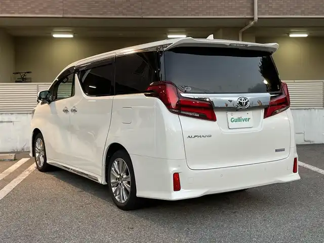 トヨタ アルファード S タイプゴールド 大阪府 2021(令3)年 2.2万km ホワイトパールクリスタルシャイン ワンオーナー/OP：T-Connectナビキッド/OP：CD・DVDデッキ/OP：TV＋AppleCarPlay＋AndroidAuto/前後ドライブレコーダー【TZ-D305W】/純正9インチディスプレイオーディオ/　フルセグTV/FM/AM/Bluetooth/ToyotaSafetySense/　・プリクラッシュセーフティ/　・レーントレーシングアシスト/　・レーダークルーズコントロール/　・ロードサインアシスト/　・アダプティブハイビームシステム/パワーバックドア/ハーフレザーシート/純正18インチアルミホイール/3眼LEDヘッドライト/LEDシーケンシャルターンランプ（フロント・リア）/後席用アクセサリーコンセント（AC100V・100W）/スペアキー1本