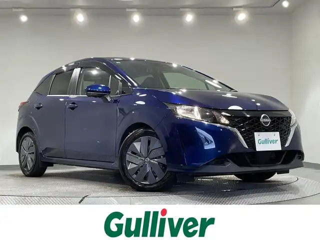 日産 ノート X 愛知県 2021(令3)年 2.2万km オーロラフレアブルーパール 純正９インチナビ　/（FM/AM/Bluetooth/USB/HDMI/AppleCarPlay/AndroidAuto/フルセグTV)/アラウンドビューモニター　/衝突軽減ブレーキ　/プロパイロット　/ブラインドスポットモニター　/ワイヤレス充電　/デジタルインナーミラー　/ビルトインＥＴＣ２．０　/ＳＯＳコール　/踏み間違い衝突防止/車線逸脱警報/標識検知機能/クリアランスソナー/ドライブレコーダー　/USB入力端子/オートライト/純正フロアマット/電動パーキングブレーキ