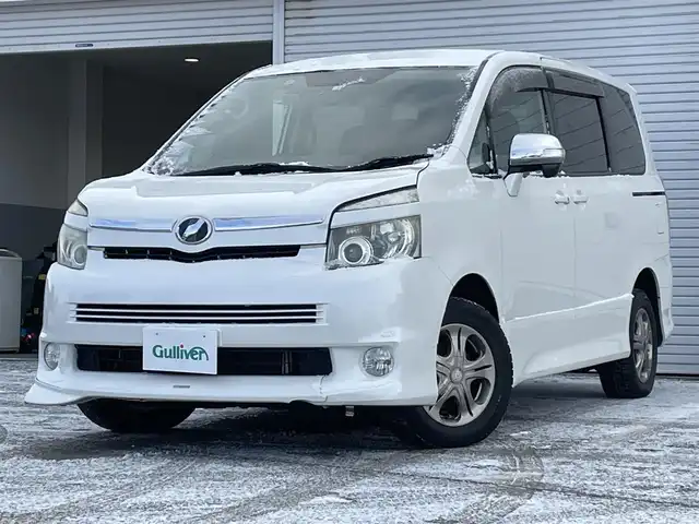 トヨタ ヴォクシー ZS 道央・札幌 2008(平20)年 18.6万km ホワイトパールクリスタルシャイン ・４WD/・寒冷地仕様/・純正HDDナビ/フルセグTV／ラジオ／ＣＤ／ＤＶＤ/・純正フリップダウンモニター/・バックカメラ/・片側パワースライドドア/・ＷＡＣ/・パドルシフト/・ドライブレコーダー/・社外エンジンスターター/・ビルトインＥＴＣ/・フォグランプ/・スペアキー/・社外15インチAW/・ウィンカーミラー/・純正フロアマット/・取扱説明書