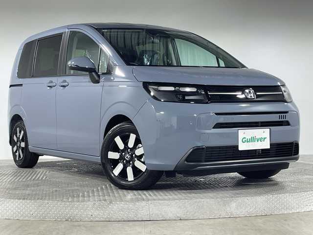 ホンダ フリード ハイブリット e:HEV AIR EX 神奈川県 2025(令7)年 0.1千km ソニックグレーパール 登録済未使用車/純正9型ディスプレイオーディオ【LXM-242ZFNI】/ホンダコネクトナビ/フルセグ　Bluetooth　AM FM　USB　iPod　/両側電動スライドドア【サンシェード】/ホンダセンシング/CMBS衝突軽減ブレーキ/誤発進抑制機能/急アクセル抑制機能/路外逸脱抑制機能/アダブティブクルーズコントロール/LKAS車線維持支援システム/先行車発進お知らせ機能/標識認識機能/ブラインドスポットインフォメーション/パーキングセンサーシステム/後退出庫サポート/オートハイビーム/革巻きステアリング/前席シートヒーター/ECON/電動パーキングブレーキ/オートブレーキホールド/プッシュスタート/スマートキー/純正15インチアルミホイール/LEDヘッドランプ/オートライト/スペアキー