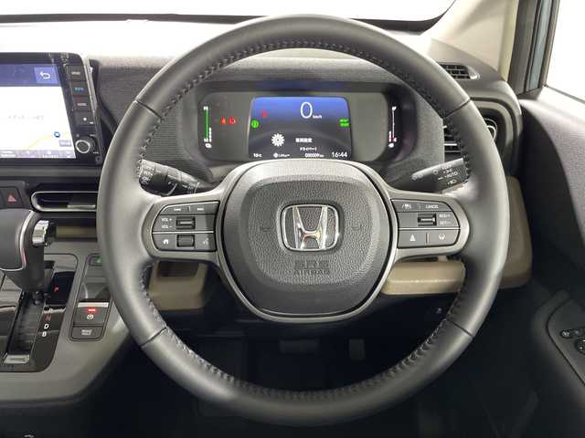 ホンダ フリード ハイブリット e:HEV AIR EX 神奈川県 2025(令7)年 0.1千km ソニックグレーパール 登録済未使用車/純正9型ディスプレイオーディオ【LXM-242ZFNI】/ホンダコネクトナビ/フルセグ　Bluetooth　AM FM　USB　iPod　/両側電動スライドドア【サンシェード】/ホンダセンシング/CMBS衝突軽減ブレーキ/誤発進抑制機能/急アクセル抑制機能/路外逸脱抑制機能/アダブティブクルーズコントロール/LKAS車線維持支援システム/先行車発進お知らせ機能/標識認識機能/ブラインドスポットインフォメーション/パーキングセンサーシステム/後退出庫サポート/オートハイビーム/革巻きステアリング/前席シートヒーター/ECON/電動パーキングブレーキ/オートブレーキホールド/プッシュスタート/スマートキー/純正15インチアルミホイール/LEDヘッドランプ/オートライト/スペアキー