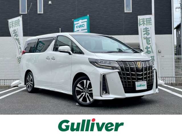 トヨタ アルファード S タイプゴールド 三重県 2021(令3)年 1.7万km ホワイトパールクリスタルシャイン 登録時16881km/三眼ヘッドライト/ハーフレザーシート/純正ナビ/（AM/FM/TV/Bluetooth/DVD/Miracast）/フルセグTV/バックカメラ/純正フリップダウンモニター/ビルトインETC/ステアリングスイッチ/レーダークルーズコントロール/オートライト/オートハイビーム/パワーバックドア/両側パワースライドドア/後席オットマン/社外レーダー/トヨタセーフティセンス/プリクラッシュセーフティ/レーンディパーチャーアシスト/クリアランスソナー/プッシュスタート/純正18インチアルミ/スペアキー/社外フロアマット