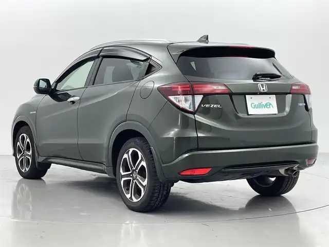 ホンダ ヴェゼル ハイブリッド Z 熊本県 2015(平27)年 6.8万km ミスティックグリーンパール 純正ナビ（ＣＤ・ＤＶＤ・フルセグ・ＢＴ）/バックカメラ　/ビルトインＥＴＣ　/クルーズコントロール　/前席シートヒーター　/衝突軽減ブレーキ　/横滑り防止　/パドルシフト/ハーフレザーシート　/オートライト/LEDヘッドライト/フォグランプ/純正フロアマット　/純正１７インチＡＷ/スマートキー/プッシュスタート/スペアキー1本