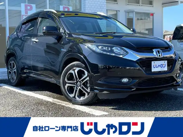 ホンダ ヴェゼル ハイブリッド Z 徳島県 2014(平26)年 12.5万km クリスタルブラックパール (株)IDOMが運営する【じしゃロン徳島店】の自社ローン専用車両になりますこちらは現金またはオートローンご利用時の価格です。/自社ローンご希望の方は別途その旨お申付け下さい”	/メーカー純正ナビゲーション　/（フルセグ/CD/DVD/BT)/バックモニター　/ハーフレザーシート　/ＬＥＤヘッドライト　/フォグランプ　/コーナーセンサー/クルーズコントロール/トラクションコントロール/ステアリングリモコン/ビルトインＥＴＣ　/ドライブレコーダー　/パドルシフト　/ECO＆スポーツモード切替/電動格納ミラー/オールオートパワーウィンドウ/室内LEDランプ/電気式パーキングブレーキ　/オートホールド　/純正フロアマット/サイドバイザー/Wエアバック/カーテンエアバック