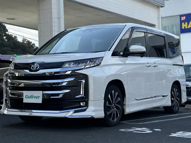 トヨタ ノア ハイブリッド S－Z 長崎県 2023(令5)年 3.2万km ホワイトパールクリスタルシャイン ワンオーナー/モデリスタフルエアロ/純正ナビ(フルセグTV/BT/CD/FM/AM)/バックカメラ/ETC/両側パワースライドドア/シートヒーター/ハーフレザーシート/ステアリングスイッチ/LEDヘッドライト/クルーズコントロール