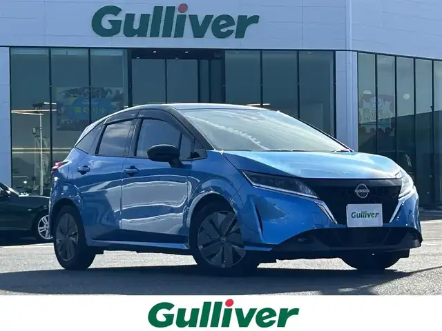 日産 ノート X 島根県 2022(令4)年 5.7万km ビビットブルー / スーパーブラック 2トーン 登録時走行距離57993km/ワンオーナー/Nissan　Connectナビ/フルセグテレビ(走行中視聴可能)/Bluetooth/HDMI/プロパイロット/全周囲カメラ/デジタルインナーミラー/ブラインドスポットモニター/ハンドルヒーター/シートヒーター(運転席・助手席)/純正ドライブレコーダー/ETC/LEDヘッドライト/フォグランプ/オートライト/ウィンカーミラー/ドアバイザー/ステアリングスイッチ/禁煙車/保証書/取扱説明書