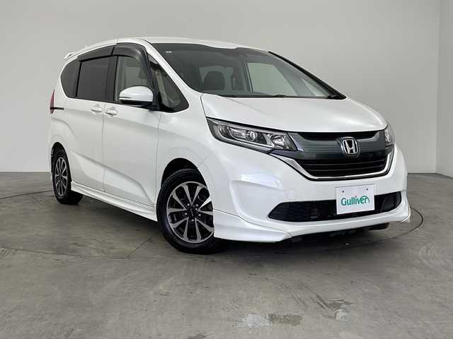 ホンダ フリード G ホンダセンシング 兵庫県 2019(令1)年 2.9万km ホワイトオーキッドパール ・純正ナビ/・Bluetooth/CD/DVD/SD/USBフルセグテレビ/・バックカメラ/・ホンダセンシング/・衝突軽減ブレーキ/・レーダークルーズコントロール/・先行車発進お知らせ機能/・路外逸脱抑制機能/・レーンキープアシスト/・標識認識機能/・自動ドアロック連動機能/・自動ドアアンロック連動機能/・横滑り防止装置/・アイドリングストップ/・純正フロアマット/・モデューロ製15インチアルミホイール/・モデリスタエアロ/・LEDオートライト/・純正前後ドライブレコーダー/・純正ビルトインETC/・スマートキー/・サーモスメーター/・ハイグロメーター