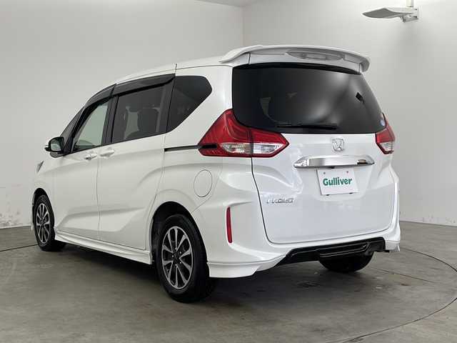 ホンダ フリード G ホンダセンシング 兵庫県 2019(令1)年 2.9万km ホワイトオーキッドパール ・純正ナビ/・Bluetooth/CD/DVD/SD/USBフルセグテレビ/・バックカメラ/・ホンダセンシング/・衝突軽減ブレーキ/・レーダークルーズコントロール/・先行車発進お知らせ機能/・路外逸脱抑制機能/・レーンキープアシスト/・標識認識機能/・自動ドアロック連動機能/・自動ドアアンロック連動機能/・横滑り防止装置/・アイドリングストップ/・純正フロアマット/・モデューロ製15インチアルミホイール/・モデリスタエアロ/・LEDオートライト/・純正前後ドライブレコーダー/・純正ビルトインETC/・スマートキー/・サーモスメーター/・ハイグロメーター