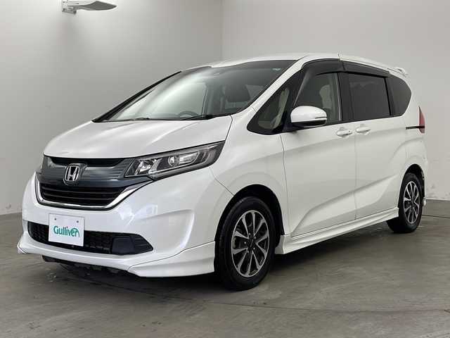 ホンダ フリード G ホンダセンシング 兵庫県 2019(令1)年 2.9万km ホワイトオーキッドパール ・純正ナビ/・Bluetooth/CD/DVD/SD/USBフルセグテレビ/・バックカメラ/・ホンダセンシング/・衝突軽減ブレーキ/・レーダークルーズコントロール/・先行車発進お知らせ機能/・路外逸脱抑制機能/・レーンキープアシスト/・標識認識機能/・自動ドアロック連動機能/・自動ドアアンロック連動機能/・横滑り防止装置/・アイドリングストップ/・純正フロアマット/・モデューロ製15インチアルミホイール/・モデリスタエアロ/・LEDオートライト/・純正前後ドライブレコーダー/・純正ビルトインETC/・スマートキー/・サーモスメーター/・ハイグロメーター