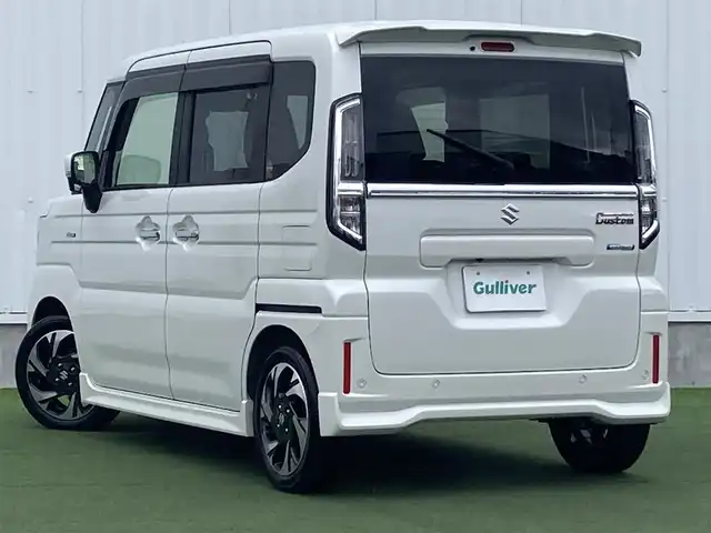 スズキ スペーシア カスタム HYBRID XS 香川県 2024(令6)年 1.2万km ピュアホワイトP 登録時走行距離：11824km/メーカー純正メモリナビ/　CD DVD BT フルセグTV/全方位カメラ/両側パワースライドドア/デュアルセンサーブレーキサポート/レーンキープアシスト/レーダークルーズコントロール/ヘッドアップディスプレイ/クリアランスソナー/LEDヘッドライト/オートライト/フォグランプ/前後ドライブレコーダー/ビルトインETC2.0/ハーフレザーシート/シートヒーター/革巻きステアリング/ステアリングヒーター/電子パーキングブレーキ/後席ロールサンシェード/サーキュレーター/アイドリングストップ/横滑り防止装置/プッシュスタート/スマートキー/スペアキー/新車時保証書/取扱説明書
