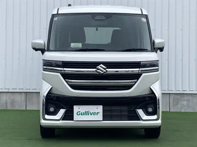 スズキ スペーシア カスタム HYBRID XS 香川県 2024(令6)年 1.2万km ピュアホワイトP 登録時走行距離：11824km/メーカー純正メモリナビ/　CD DVD BT フルセグTV/全方位カメラ/両側パワースライドドア/デュアルセンサーブレーキサポート/レーンキープアシスト/レーダークルーズコントロール/ヘッドアップディスプレイ/クリアランスソナー/LEDヘッドライト/オートライト/フォグランプ/前後ドライブレコーダー/ビルトインETC2.0/ハーフレザーシート/シートヒーター/革巻きステアリング/ステアリングヒーター/電子パーキングブレーキ/後席ロールサンシェード/サーキュレーター/アイドリングストップ/横滑り防止装置/プッシュスタート/スマートキー/スペアキー/新車時保証書/取扱説明書