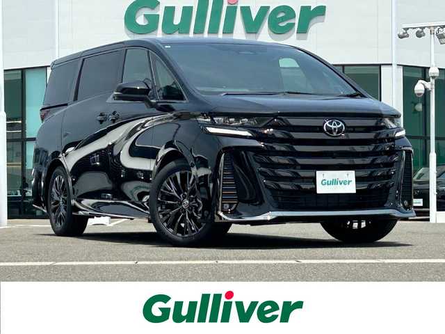 トヨタ ヴェルファイア Z プレミア 佐賀県 2025(令7)年 0.1万km未満 ブラック 登録済未使用車/登録時走行距離9km/左右独立ムーンルーフ/純正14型ディスプレイオーディオ/・HDMI/BT/AM/FM/フルセグTV/・Apple Car Play/Android Auto/パノラミックビューモニター/純正14型リヤシートエンターテインメントシステム/ビルトインETC2.0/純正前後ドライブレコーダー/黒革シート/・DN、セカンド席パワーシート/・DNセカンド席シートヒーター/ベンチレーション/・マイコンプリセットドライビングポジションシステム/革巻きステアリング【木目調】/・ステアリングヒーター/・パドルシフト/両側パワースライドドア/パワーバックドア/デジタルインナーミラー/カラーヘッドアップディスプレイ/後席用パワーサイドサンシェード/電動パーキングブレーキ/アクセサリーコンセント/置くだけ充電/純正19インチアルミホイール/3眼LEDヘッドランプ/アダプティブハイビームシステム/Toyota Safety Sence/・PCS/LTA/FCTA/・レーダークルーズコントロール/・パーキングサポートブレーキ/・ブラインドスポットモニター/・Advanced Park/新車保証書・取扱説明書/スペアキー1本