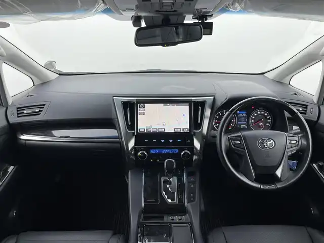 トヨタ ヴェルファイア Z Gエディション 富山県 2018(平30)年 2万km バーニングブラッククリスタルシャインガラスフレーク 純正10型ナビ（AM/FM/DVD/BT）/バックカメラ/純正12型後席モニター/両側パワースライドドア/パワーバックドア/ドライブレコーダー/ETC/レザーシート/D/N席パワーシート/D席メモリシート/シートヒーター/エアシート/ハンドルヒーター/衝突被害軽減システム/レーダークルーズコントロール/レーンキープアシスト/横滑り防止装置/純正アルミホイール/純正フロアマット/オートLEDライト/フォグライト/オートホールド付電子パーキング/ウッドコンビステアリング/ステアリングスイッチ/スマートキー