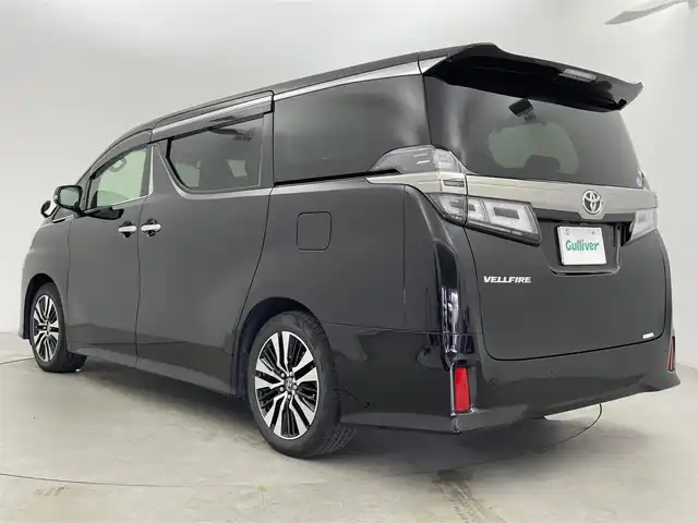 トヨタ ヴェルファイア Z Gエディション 富山県 2018(平30)年 2万km バーニングブラッククリスタルシャインガラスフレーク 純正10型ナビ（AM/FM/DVD/BT）/バックカメラ/純正12型後席モニター/両側パワースライドドア/パワーバックドア/ドライブレコーダー/ETC/レザーシート/D/N席パワーシート/D席メモリシート/シートヒーター/エアシート/ハンドルヒーター/衝突被害軽減システム/レーダークルーズコントロール/レーンキープアシスト/横滑り防止装置/純正アルミホイール/純正フロアマット/オートLEDライト/フォグライト/オートホールド付電子パーキング/ウッドコンビステアリング/ステアリングスイッチ/スマートキー