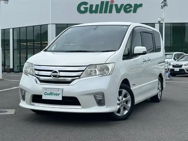 日産 セレナ ハイウェイS G Sハイブリッド 愛媛県 2013(平25)年 4.8万km ブリリアントホワイトパール 禁煙車/登録時走行距離：48060km/ETC/ディーラーＯＰ純正ナビ　/BT/CD/DVD/AM/FM/３列シート/横滑り防止装置/キセノンヘッドライト/バックカメラ/両側パワースライドドア