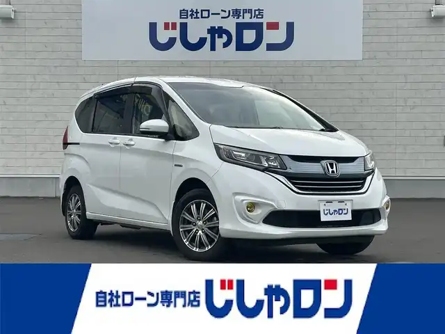 ホンダ フリード ハイブリット G ホンダセンシング 道北・旭川 2017(平29)年 12.6万km ホワイトオーキッドパール (株)IDOMが運営する【じしゃロン旭川店】の自社ローン専用車両になります。こちらは現金またはオートローンご利用時の価格です。自社ローンご希望の方は別途その旨お申付け下さい・/　/・純正ナビ(CD/BT/SD/ワンセグ)/・バックカメラ/・ビルトインETC/・レーダーブレー/・クルーズコントロール/・ステアリングリモコン/・両側パワースライドドア/・両席シートヒーター/・プッシュスタート/・スマートキー2個/・フォグランプ/・取扱説明書
