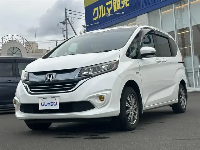 ホンダ フリード ハイブリット G ホンダセンシング 道北・旭川 2017(平29)年 12.6万km ホワイトオーキッドパール (株)IDOMが運営する【じしゃロン旭川店】の自社ローン専用車両になります。こちらは現金またはオートローンご利用時の価格です。自社ローンご希望の方は別途その旨お申付け下さい・/　/・純正ナビ(CD/BT/SD/ワンセグ)/・バックカメラ/・ビルトインETC/・レーダーブレー/・クルーズコントロール/・ステアリングリモコン/・両側パワースライドドア/・両席シートヒーター/・プッシュスタート/・スマートキー2個/・フォグランプ/・取扱説明書
