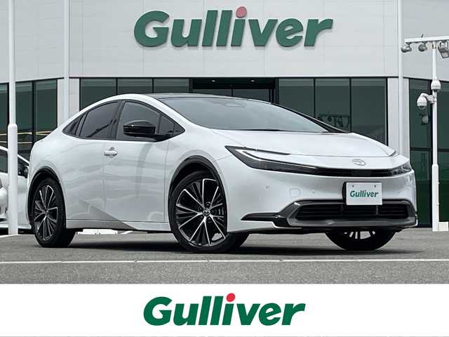 トヨタ プリウス Z 佐賀県 2023(令5)年 3.4万km プラチナホワイトパールマイカ ガラスルーフ/Toyota Safety Sense/・プリクラッシュセーフティ/・レーントレーシングアシスト/・レーンチェンジアシスト/・先行車発進告知機能/・オートマチックハイビーム/・レーダークルーズコントロール/・クリアランスソナー/・パーキングサポートブレーキ/・ロードサインアシスト/・ブラインドスポットモニター/・アドバンストパーク/純正12.3インチナビ/・フルセグTV/USB/Bluetooth/AppleCarPlay/パノラミックビューモニター/アルパインドラレコ一体型デジタルインナーミラー/電子パーキングブレーキ/AUTO　HOLD/D席パワーシート（メモリ機能付）/D＋N席シートヒーター・エアシート/ステアリングヒーター/ステアリングリモコン　/100V電源/19インチ純正アルミホイール/純正LEDヘッドライト/ETC2.0/フロアマット