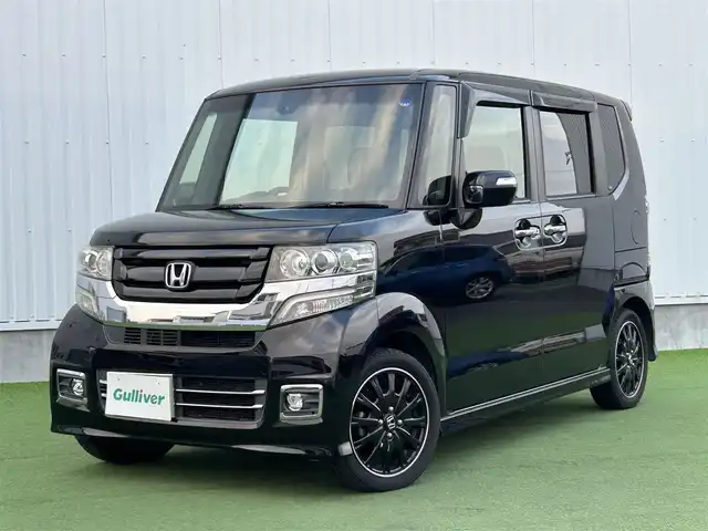ホンダ Ｎ ＢＯＸ カスタム ターボ SSブラックSパッケージ 香川県 2016(平28)年 7.2万km クリスタルブラックパール ワンオーナー/CTBA/　・衝突回避支援システム/　・衝突被害軽減ブレーキ/　・誤発進抑制機能/オートハイビーム/VSA（横滑り防止装置）/LKAS（車線維持支援システム）/純正8インチSDナビ/　→フルセグ/CD/DVD/Bluetooth/バックカメラ/両側パワースライドドア/ハーフレザーシート/前席シートヒーター/ブルーステッチ本革巻ステアリング/ステアリングリモコン/パドルシフト/純正オールブラック15インチアルミ/リアバックテーブル/リアサンシェード/チップアップシート/サイドビューサポートミラー/ビルトインETC/プッシュスタート/アイドリングストップ