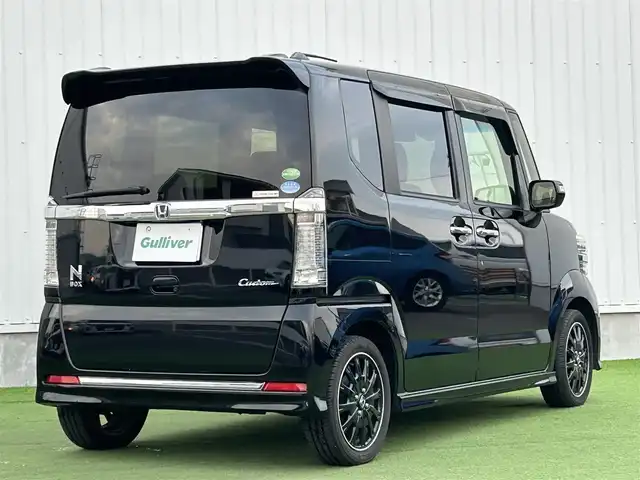 ホンダ Ｎ ＢＯＸ カスタム ターボ SSブラックSパッケージ 香川県 2016(平28)年 7.2万km クリスタルブラックパール ワンオーナー/CTBA/　・衝突回避支援システム/　・衝突被害軽減ブレーキ/　・誤発進抑制機能/オートハイビーム/VSA（横滑り防止装置）/LKAS（車線維持支援システム）/純正8インチSDナビ/　→フルセグ/CD/DVD/Bluetooth/バックカメラ/両側パワースライドドア/ハーフレザーシート/前席シートヒーター/ブルーステッチ本革巻ステアリング/ステアリングリモコン/パドルシフト/純正オールブラック15インチアルミ/リアバックテーブル/リアサンシェード/チップアップシート/サイドビューサポートミラー/ビルトインETC/プッシュスタート/アイドリングストップ