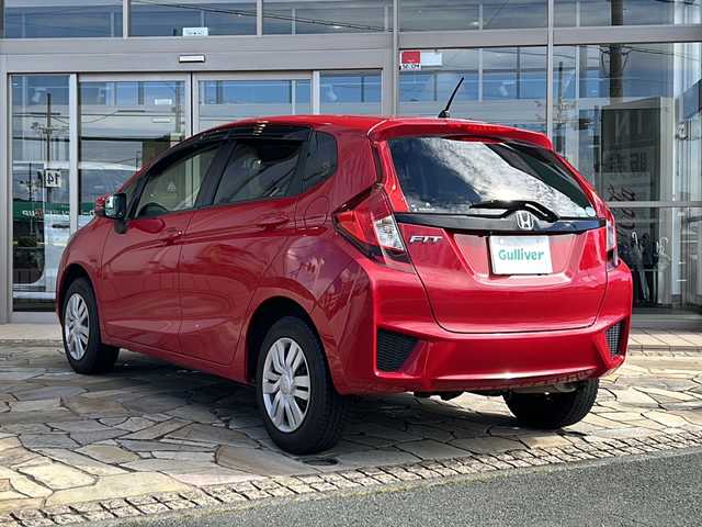 ホンダ フィット 13G Fパッケージ 静岡県 2014(平26)年 3.4万km ミラノレッド 純正ナビ/・FM/AM/・CD/DVD/・USB/・Bluetooth/・ワンセグ/・SD/主要装備/・バックカメラ/・オートエアコン/・ＥＴＣ/・オートライト/・ステアリングスイッチ/・横滑り防止装置/・プッシュスタート/・純正ホイールキャップ/・スタッドレスタイヤ/・ＬＥＤヘッドライト/・純正フロアマット