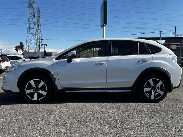 スバル インプレッサ ＸＶ ハイブリッド 2．0i－L アイサイト 道央・札幌 2014(平26)年 11.9万km サテンホワイトパール ４WD/社外SDナビ/AM/FM/BT/SD/CD/DVD/フルセグ/衝突被害軽減ブレーキ/アイサイト/横滑り防止装置/レーダークルーズコントロール/レーンキープアシスト/バックカメラ/ビルトインETC/前席パワーシート/革巻きステアリング/ステアリングリモコン/パドルシフト/MTモード付AT/プッシュスタート/スマートキー/キセノンヘッドライト/オートライト/フォグランプ/電動格納ミラー/ウィンカーミラー/純正フロアマット