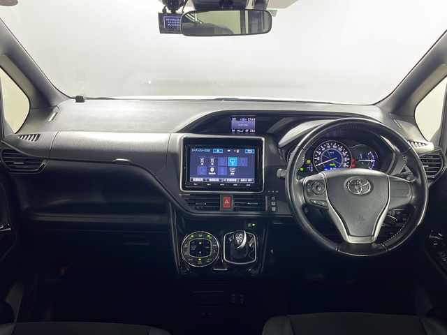 トヨタ ノア ハイブリッド Si ダブルバイビー 沖縄県 2018(平30)年 8.2万km ホワイトパールクリスタルシャイン 禁煙車　/７人乗り　/純正９インチナビ　/（フルセグＴＶ　ＣＤ　ＤＶＤ　Ｂｌｕｅｔｏｏｔｈ）　/純正フリップダウンモニター　/両側パワースライドドア　/前後ドライブレコーダー　/ビルトインＥＴＣ２．０/トヨタセーフティセンス/・プリクラッシュセーフティ/・レーンディパーチャーアラート/・オートマチックハイビーム/クルーズコントロール/ステアリングスイッチ/ハーフレザーシート/シートヒーター/LEDヘッドライト/純正アルミホイール