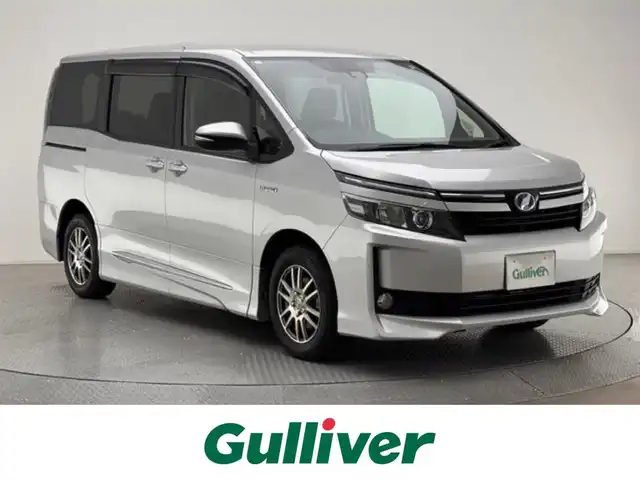 トヨタ ヴォクシー ハイブリッド V 兵庫県 2016(平28)年 9.2万km シルバー ALPIINEナビ（EX10V）/フルセグTV・CD・DVD・BT・SD・HDMI・USB/ビルトインETC/クルコン/LEDヘッドライト/オートハイビーム/シートヒーター/プリクラッシュセーフティ/レーンキープアシスト/スペアキー
