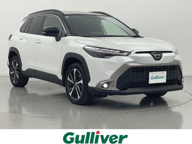 トヨタ カローラ クロス ハイブリッド Z 熊本県 2024(令6)年 1.1万km アティチュードブラックマイカ/プラチナホワイトパールマイカ トヨタチームメイト/禁煙車　/ガラスルーフ　/純正ドライブレコーダー　/全周囲カメラ　/純正１０，５型ディスプレイオーディオ　/ビルトインＥＴＣ２．０　/トヨタセーフティーセンス/・プリクラッシュセーフティ/・ロードサインアシスト/・レーンディパーチャーアラート/・レーダークルーズコントロール/・オートマチックハイビーム/・ブラインドスポットモニター/前後クリアランスソナー　/前席シートヒーター　/運転席パワーシート/パワーバックドア/ハーフレザーシート/純正フロアマット/純正１８インチAW/オートライト/LEDヘッドライト/フォグライト/スマートキー/プッシュスタート/スペアキー1本/保証書/取扱説明書