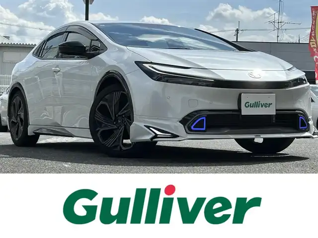 トヨタ プリウス Z 奈良県 2024(令6)年 1.6万km プラチナホワイトパールマイカ 1オーナー/モデリスタフルエアロ/モデリスタアルミ/純正メーカーナビ/TV/BT//アラウンドビューカメラ/追従式クルコン/コーナーセンサー/レーンキープアシスト/ETC2.0/バックカメラ/電動リアゲート/パワーシート/フルフラットシート/シートヒーター/エアシート/置くだけ充電/オートLEDライト/保証書・取説・スペアキー付