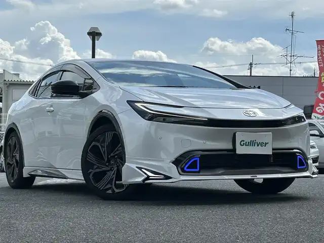 トヨタ プリウス Z 奈良県 2024(令6)年 1.6万km プラチナホワイトパールマイカ 1オーナー/モデリスタフルエアロ/モデリスタアルミ/純正メーカーナビ/TV/BT//アラウンドビューカメラ/追従式クルコン/コーナーセンサー/レーンキープアシスト/ETC2.0/バックカメラ/電動リアゲート/パワーシート/フルフラットシート/シートヒーター/エアシート/置くだけ充電/オートLEDライト/保証書・取説・スペアキー付