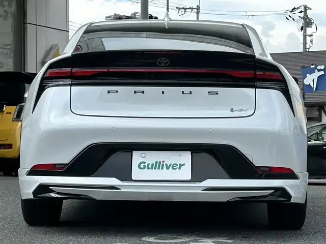 トヨタ プリウス Z 奈良県 2024(令6)年 1.6万km プラチナホワイトパールマイカ 1オーナー/モデリスタフルエアロ/モデリスタアルミ/純正メーカーナビ/TV/BT//アラウンドビューカメラ/追従式クルコン/コーナーセンサー/レーンキープアシスト/ETC2.0/バックカメラ/電動リアゲート/パワーシート/フルフラットシート/シートヒーター/エアシート/置くだけ充電/オートLEDライト/保証書・取説・スペアキー付