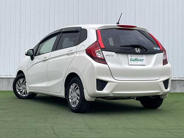 ホンダ フィット 13G Lパッケージ 香川県 2014(平26)年 8万km プレミアムホワイトパール 純正７型ＳＤナビ/・Bluetooth/・AM/FM/・ワンセグTV/ＥＴＣ/ＬＥＤヘッドライト/純正フロアマット/プッシュスタート/スマートキー/アイドリングストップ/パワーステアリング/パワーウィンドウ/オートライト/盗難防止装置/横滑り防止装置/ＡＢＳ/Wエアバッグ