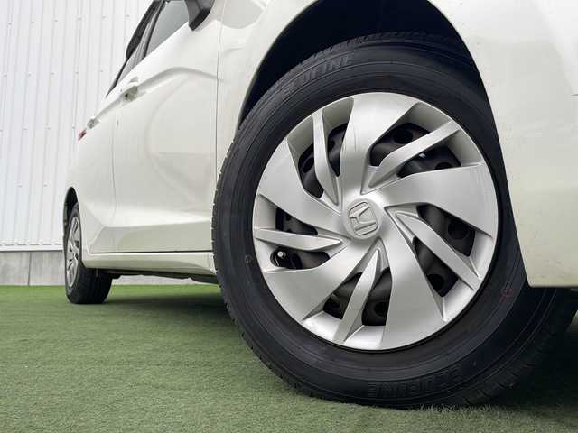 ホンダ フィット 13G Lパッケージ 香川県 2014(平26)年 8万km プレミアムホワイトパール 純正７型ＳＤナビ/・Bluetooth/・AM/FM/・ワンセグTV/ＥＴＣ/ＬＥＤヘッドライト/純正フロアマット/プッシュスタート/スマートキー/アイドリングストップ/パワーステアリング/パワーウィンドウ/オートライト/盗難防止装置/横滑り防止装置/ＡＢＳ/Wエアバッグ