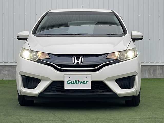 ホンダ フィット 13G Lパッケージ 香川県 2014(平26)年 8万km プレミアムホワイトパール 純正７型ＳＤナビ/・Bluetooth/・AM/FM/・ワンセグTV/ＥＴＣ/ＬＥＤヘッドライト/純正フロアマット/プッシュスタート/スマートキー/アイドリングストップ/パワーステアリング/パワーウィンドウ/オートライト/盗難防止装置/横滑り防止装置/ＡＢＳ/Wエアバッグ