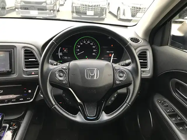 ホンダ ヴェゼル ハイブリッド Z ホンダセンシング 富山県 2017(平29)年 7.2万km クリスタルブラックパール 社外ナビ/フルセグTV/Bluetooth/バックカメラ/衝突被害軽減ブレーキ/レーンキープアシスト/レーダークルーズコントロール/プッシュスタート/スマートキー/革巻きステアリング/ステアリングスイッチ/ハーフレザーシート/プッシュスタート/スマートキー/スペアキー1本/シートヒーター/ルーフレール/スタッドレスタイヤ車載/ETC