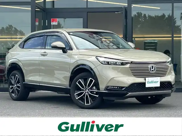 ホンダ ヴェゼル ハイブリッド e:HEV Z 栃木県 2023(令5)年 0.9万km サンドカーキパール ホンダセンシング/純正ワイドナビ/フルセグTV/Bluetooth/USB/スマホ連携/バックカメラ/ビルトインETC2.0/前後ドライブレコーダー/ハーフレザーシート/シートヒーター/ワイヤレス充電/ステアリングヒーター/シーケンシャルウィンカー/パワーバックドア/電子パーキングブレーキ/ブラインドスポットモニター/ヒルディセントコントロール/スマートキー