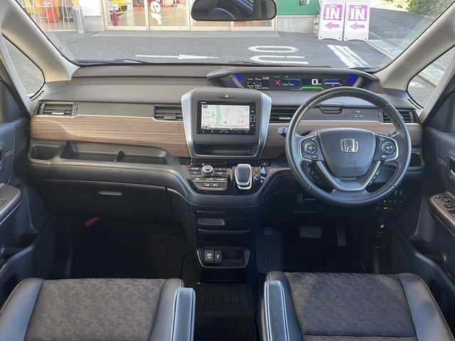 ホンダ フリード ハイブリット クロスター ホンダセンシング 愛知県 2022(令4)年 1.3万km シルバーミストグリーンM /禁煙車//ワンオーナー//純正ナビ【VXM-224VFi】//フルセグTV・DVD・Bluetooth//両側パワースライドドア//LEDヘッドライト+アクティブコーナリングライト//オートライト//CROSSTAR専用装備//ルーフレール//純正15インチアルミホイール//木目調インパネミドルエリア//コンビシート(プライムスムース×ファブリック)//Cパッケージ（ロールサンシェード、IRカット、コンフォートビューパッケージ、D/N席シートヒーター、プラズマクラスター技術搭載フルオートエアコン//HondaSENSING//衝突軽減ブレーキ//先行車発進お知らせ機能//歩行者事故低減ステアリング//路外逸脱抑制機能//アダプティブクルーズコントロール//レーンキープアシスト//誤発進抑制苦悩//後方誤発進抑制機能//電動格納式ウインカーミラー//オートリトラミラー//純正フロアマット//ステアリングスイッチ//ETC//オートライト//スペアキー//新車保証書//取扱説明書