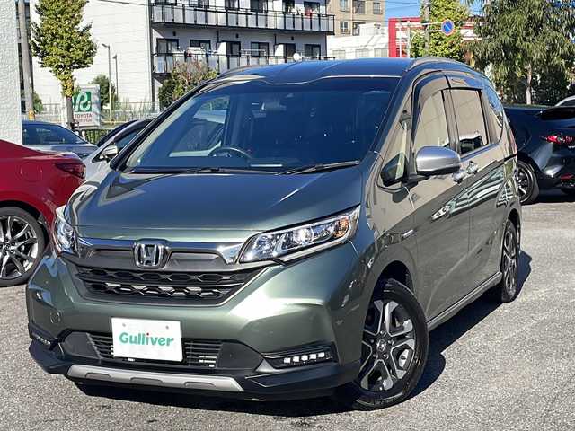 ホンダ フリード ハイブリット クロスター ホンダセンシング 愛知県 2022(令4)年 1.3万km シルバーミストグリーンM /禁煙車//ワンオーナー//純正ナビ【VXM-224VFi】//フルセグTV・DVD・Bluetooth//両側パワースライドドア//LEDヘッドライト+アクティブコーナリングライト//オートライト//CROSSTAR専用装備//ルーフレール//純正15インチアルミホイール//木目調インパネミドルエリア//コンビシート(プライムスムース×ファブリック)//Cパッケージ（ロールサンシェード、IRカット、コンフォートビューパッケージ、D/N席シートヒーター、プラズマクラスター技術搭載フルオートエアコン//HondaSENSING//衝突軽減ブレーキ//先行車発進お知らせ機能//歩行者事故低減ステアリング//路外逸脱抑制機能//アダプティブクルーズコントロール//レーンキープアシスト//誤発進抑制苦悩//後方誤発進抑制機能//電動格納式ウインカーミラー//オートリトラミラー//純正フロアマット//ステアリングスイッチ//ETC//オートライト//スペアキー//新車保証書//取扱説明書