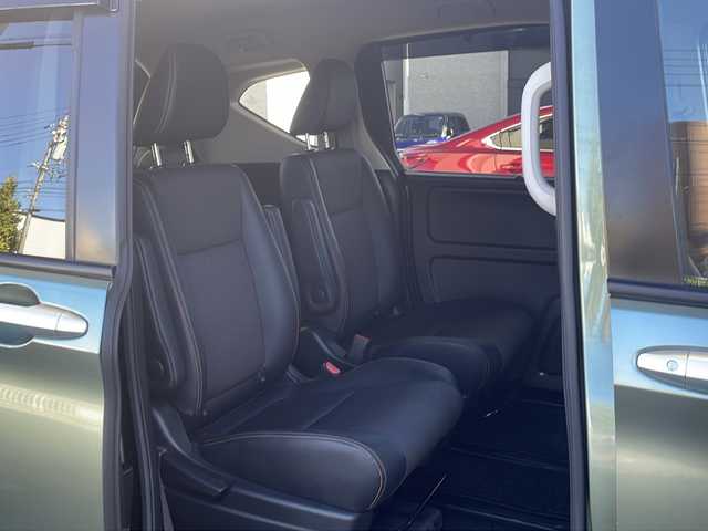 ホンダ フリード ハイブリット クロスター ホンダセンシング 愛知県 2022(令4)年 1.3万km シルバーミストグリーンM /禁煙車//ワンオーナー//純正ナビ【VXM-224VFi】//フルセグTV・DVD・Bluetooth//両側パワースライドドア//LEDヘッドライト+アクティブコーナリングライト//オートライト//CROSSTAR専用装備//ルーフレール//純正15インチアルミホイール//木目調インパネミドルエリア//コンビシート(プライムスムース×ファブリック)//Cパッケージ（ロールサンシェード、IRカット、コンフォートビューパッケージ、D/N席シートヒーター、プラズマクラスター技術搭載フルオートエアコン//HondaSENSING//衝突軽減ブレーキ//先行車発進お知らせ機能//歩行者事故低減ステアリング//路外逸脱抑制機能//アダプティブクルーズコントロール//レーンキープアシスト//誤発進抑制苦悩//後方誤発進抑制機能//電動格納式ウインカーミラー//オートリトラミラー//純正フロアマット//ステアリングスイッチ//ETC//オートライト//スペアキー//新車保証書//取扱説明書