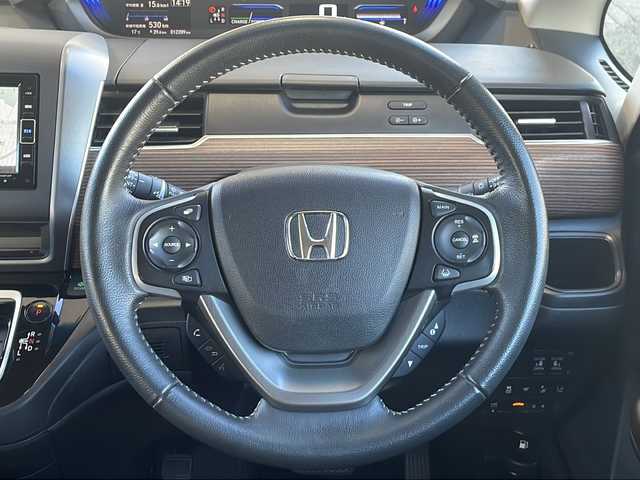 ホンダ フリード ハイブリット クロスター ホンダセンシング 愛知県 2022(令4)年 1.3万km シルバーミストグリーンM /禁煙車//ワンオーナー//純正ナビ【VXM-224VFi】//フルセグTV・DVD・Bluetooth//両側パワースライドドア//LEDヘッドライト+アクティブコーナリングライト//オートライト//CROSSTAR専用装備//ルーフレール//純正15インチアルミホイール//木目調インパネミドルエリア//コンビシート(プライムスムース×ファブリック)//Cパッケージ（ロールサンシェード、IRカット、コンフォートビューパッケージ、D/N席シートヒーター、プラズマクラスター技術搭載フルオートエアコン//HondaSENSING//衝突軽減ブレーキ//先行車発進お知らせ機能//歩行者事故低減ステアリング//路外逸脱抑制機能//アダプティブクルーズコントロール//レーンキープアシスト//誤発進抑制苦悩//後方誤発進抑制機能//電動格納式ウインカーミラー//オートリトラミラー//純正フロアマット//ステアリングスイッチ//ETC//オートライト//スペアキー//新車保証書//取扱説明書