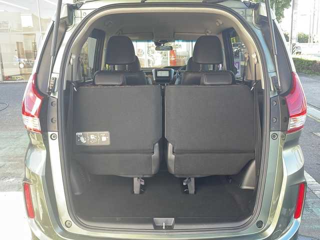 ホンダ フリード ハイブリット クロスター ホンダセンシング 愛知県 2022(令4)年 1.3万km シルバーミストグリーンM /禁煙車//ワンオーナー//純正ナビ【VXM-224VFi】//フルセグTV・DVD・Bluetooth//両側パワースライドドア//LEDヘッドライト+アクティブコーナリングライト//オートライト//CROSSTAR専用装備//ルーフレール//純正15インチアルミホイール//木目調インパネミドルエリア//コンビシート(プライムスムース×ファブリック)//Cパッケージ（ロールサンシェード、IRカット、コンフォートビューパッケージ、D/N席シートヒーター、プラズマクラスター技術搭載フルオートエアコン//HondaSENSING//衝突軽減ブレーキ//先行車発進お知らせ機能//歩行者事故低減ステアリング//路外逸脱抑制機能//アダプティブクルーズコントロール//レーンキープアシスト//誤発進抑制苦悩//後方誤発進抑制機能//電動格納式ウインカーミラー//オートリトラミラー//純正フロアマット//ステアリングスイッチ//ETC//オートライト//スペアキー//新車保証書//取扱説明書