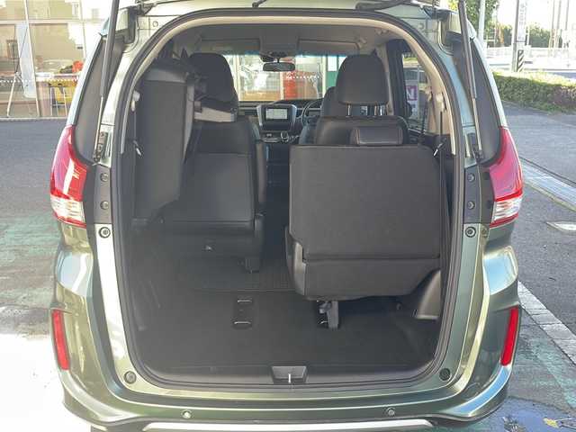 ホンダ フリード ハイブリット クロスター ホンダセンシング 愛知県 2022(令4)年 1.3万km シルバーミストグリーンM /禁煙車//ワンオーナー//純正ナビ【VXM-224VFi】//フルセグTV・DVD・Bluetooth//両側パワースライドドア//LEDヘッドライト+アクティブコーナリングライト//オートライト//CROSSTAR専用装備//ルーフレール//純正15インチアルミホイール//木目調インパネミドルエリア//コンビシート(プライムスムース×ファブリック)//Cパッケージ（ロールサンシェード、IRカット、コンフォートビューパッケージ、D/N席シートヒーター、プラズマクラスター技術搭載フルオートエアコン//HondaSENSING//衝突軽減ブレーキ//先行車発進お知らせ機能//歩行者事故低減ステアリング//路外逸脱抑制機能//アダプティブクルーズコントロール//レーンキープアシスト//誤発進抑制苦悩//後方誤発進抑制機能//電動格納式ウインカーミラー//オートリトラミラー//純正フロアマット//ステアリングスイッチ//ETC//オートライト//スペアキー//新車保証書//取扱説明書