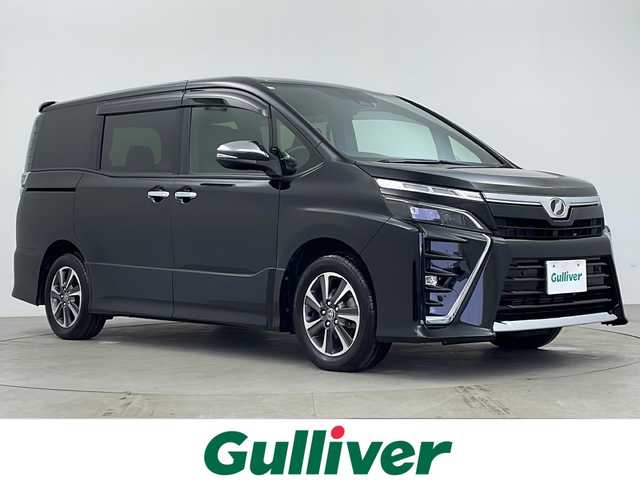 トヨタ ヴォクシー ZS 煌Ⅱ 鹿児島県 2020(令2)年 4.6万km ブラック 純正10インチSDナビ/（Bluetooth/フルセグTV/FM/AM/CD/DVD）/純正フリップダウンモニター/バックカメラ/両側パワースライドドア/社外前後ドライブレコーダー/ビルトインETC/オートライト/オートマチックハイビーム/LEDヘッドライト/前後コーナーセンサー/純正フロアマット/ドアバイザー/クルーズコントロール/スマートキー/プッシュスタート