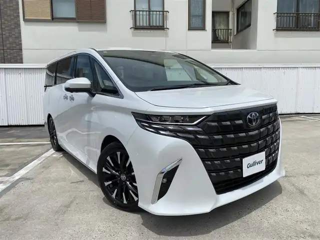 トヨタ アルファードハイブリット エグゼクティブ ラウンジ 広島県 2025(令7)年 0.1万km未満 プラチナホワイトパールマイカ ワンオーナー/トヨタチームメイト/ベージュプレミアムナッパ革シート/左右独立ムーンルーフ/純正OP:19インチアルミホイール/JBLプレミアムサウンドシステム/14インチリアエンターテイメント/14インチディスプレイオーディオプラス/エグゼクティブラウンジシート/デジタルインナーミラー/カラーヘッドアップディスプレイ/パノラミックビューカメラ/フルセグTV・スマートキー/保証書あり/取り扱い説明書あり/スペア（スマートキー）あり