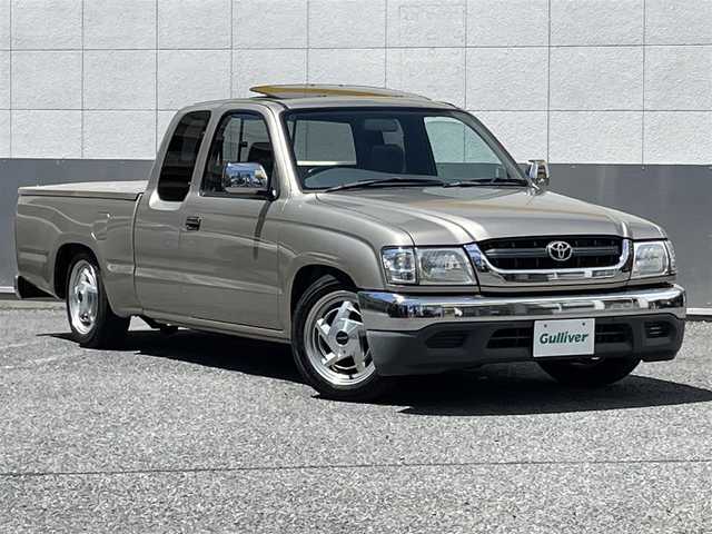 トヨタ ハイラックス スポーツピック エクストラキャブ 東京都 2001(平13)年 4.8万km シャンパンマイカM サンルーフ/社外CDオーディオ/社外16インチアルミホイール/メッキドアミラー/ファブリックスポーツシート/シートバックポケット/ETC/メッキリアバンパー/メッキフロントバンパー/プライバシーガラス/純正ハンドル/純正15インチタイヤ有/純正マフラー有/純正フロアマット/取扱説明書