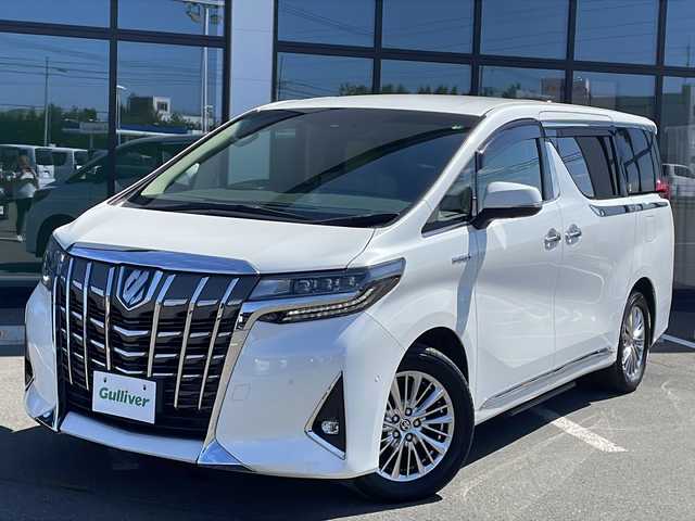 トヨタ アルファードハイブリット G 道東・釧路十勝 2020(令2)年 3.5万km ホワイトパールクリスタルシャイン ・ワンオーナー/・4WD/・純正9インチディスプレイオーディオ/（フルセグ・CD・DVD・Bluetooth・USB・HDMI）/・パノラミックビューモニター/・純正13.3インチフリップダウンモニター/・両側パワースライドドア/・ベージュレザーシート/・シートヒーター/・エアコンシート/・パワーシート/・助手席電動オットマン/・JBLプレミアムサウンド/・トヨタセーフティセンス/・プリクラッシュセーフティ/・レーントレーシングアシスト/・アダプティブハイビームシステム/・レーダークルーズコントロール/・ロードサインアシスト/・インテリジェントパーキングアシスト/・リアクロストラフィックアラート/・ブラインドスポットモニター/・デジタルインナーミラー /・前後ドライブレコーダー/・パワーバックドア/・サイドステップ/・コンビハンドル/・LEDヘッドライト/・LEDフォグライト/・プッシュスタートボタン/・スマートキー/・ドアバイザー/・純正17インチアルミホイール/・AC100V/・新車時保証書/・取扱説明書/・ナビ取扱説明書