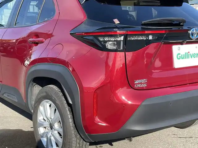 トヨタ ヤリスクロス ハイブリッド G 道央・札幌 2023(令5)年 0.5万km センシュアルレッドマイカ ワンオーナー/純正ナビ(AM/FM/BT/USB)/バックカメラ/全方位モニター/ウィンカーミラー/クルーズコントロール(追従走行あり)/ドアバイザー/プッシュスタート/オートライト/オートマチックハイビーム/フォグランプ/オートブレーキホールド/防眩ミラー/レーンキープアシスト/横滑り防止装置/ダウンヒルアシストコントロール/盗難防止装置/DRIVE MODE/EV MODE/積込冬タイヤ/　　（205/65R16 社外AW 22年製溝7mm）