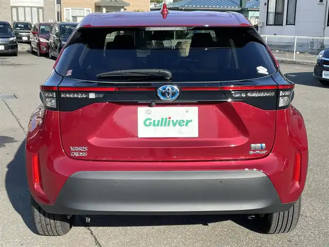 トヨタ ヤリスクロス ハイブリッド G 道央・札幌 2023(令5)年 0.5万km センシュアルレッドマイカ ワンオーナー/純正ナビ(AM/FM/BT/USB)/バックカメラ/全方位モニター/ウィンカーミラー/クルーズコントロール(追従走行あり)/ドアバイザー/プッシュスタート/オートライト/オートマチックハイビーム/フォグランプ/オートブレーキホールド/防眩ミラー/レーンキープアシスト/横滑り防止装置/ダウンヒルアシストコントロール/盗難防止装置/DRIVE MODE/EV MODE/積込冬タイヤ/　　（205/65R16 社外AW 22年製溝7mm）